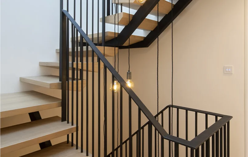 This image shows the stair case of the Coach House project.