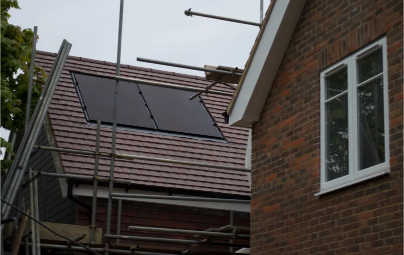 This image depicts a close up of the brick work on the new houses as well as the new windows and roof which was recently laid down.