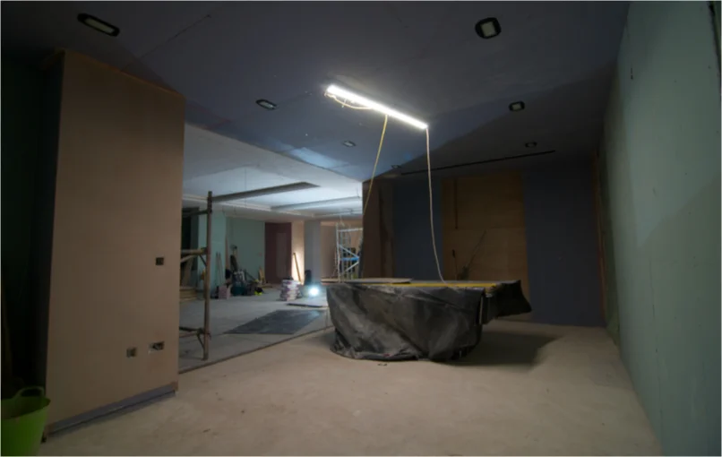 This image depicts a room in the basement which is plaster boarded and ready for plastering.